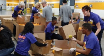 KLA employees sorting food at the Second Harvest Food Bank