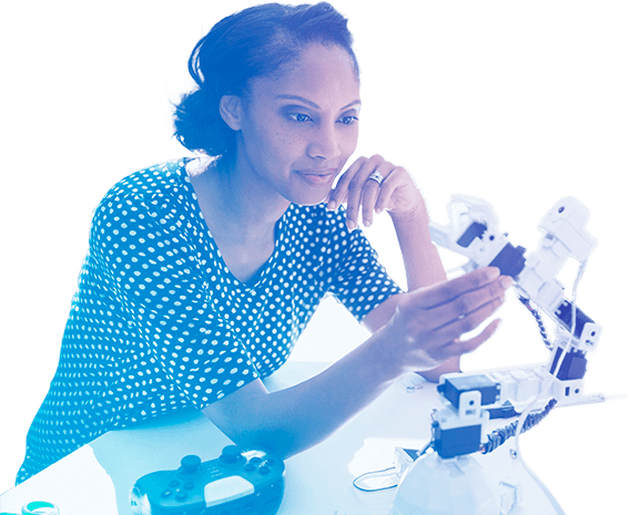 Woman inspecting a robotic arm