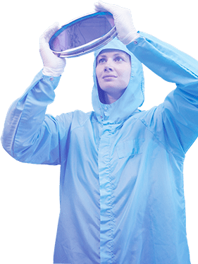 Scientist holding up glass circle